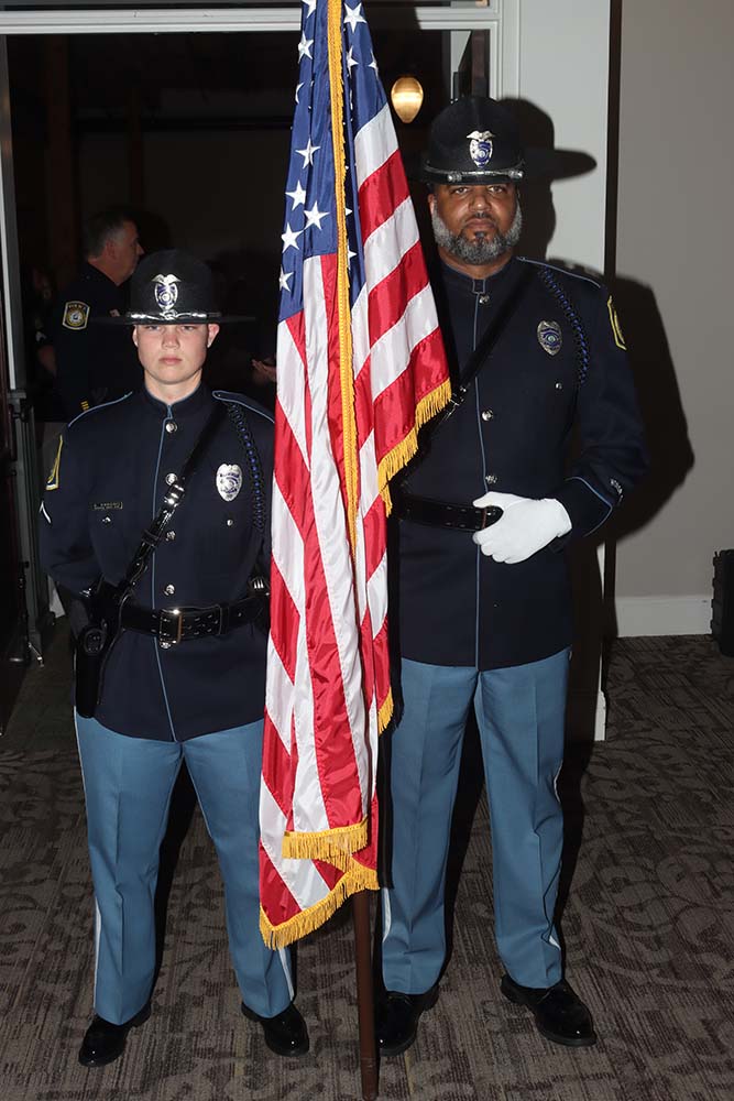 Members of Columbus FOP holding flag